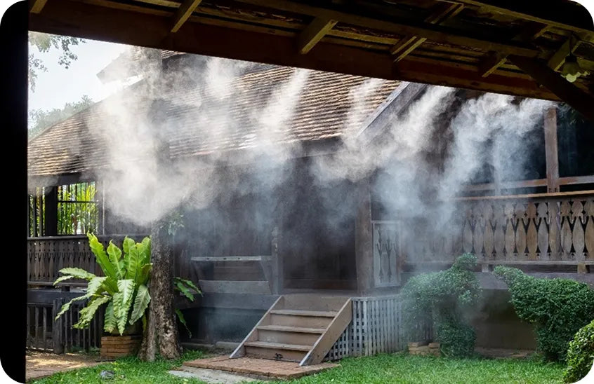 High pressure misting system installed in a wooden gazebo surrounded by tropical plants - maintenance and troubleshooting guide