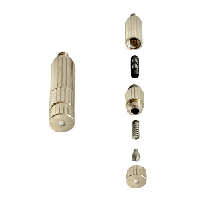 Disassembled view of a misting nozzle, showing internal components.